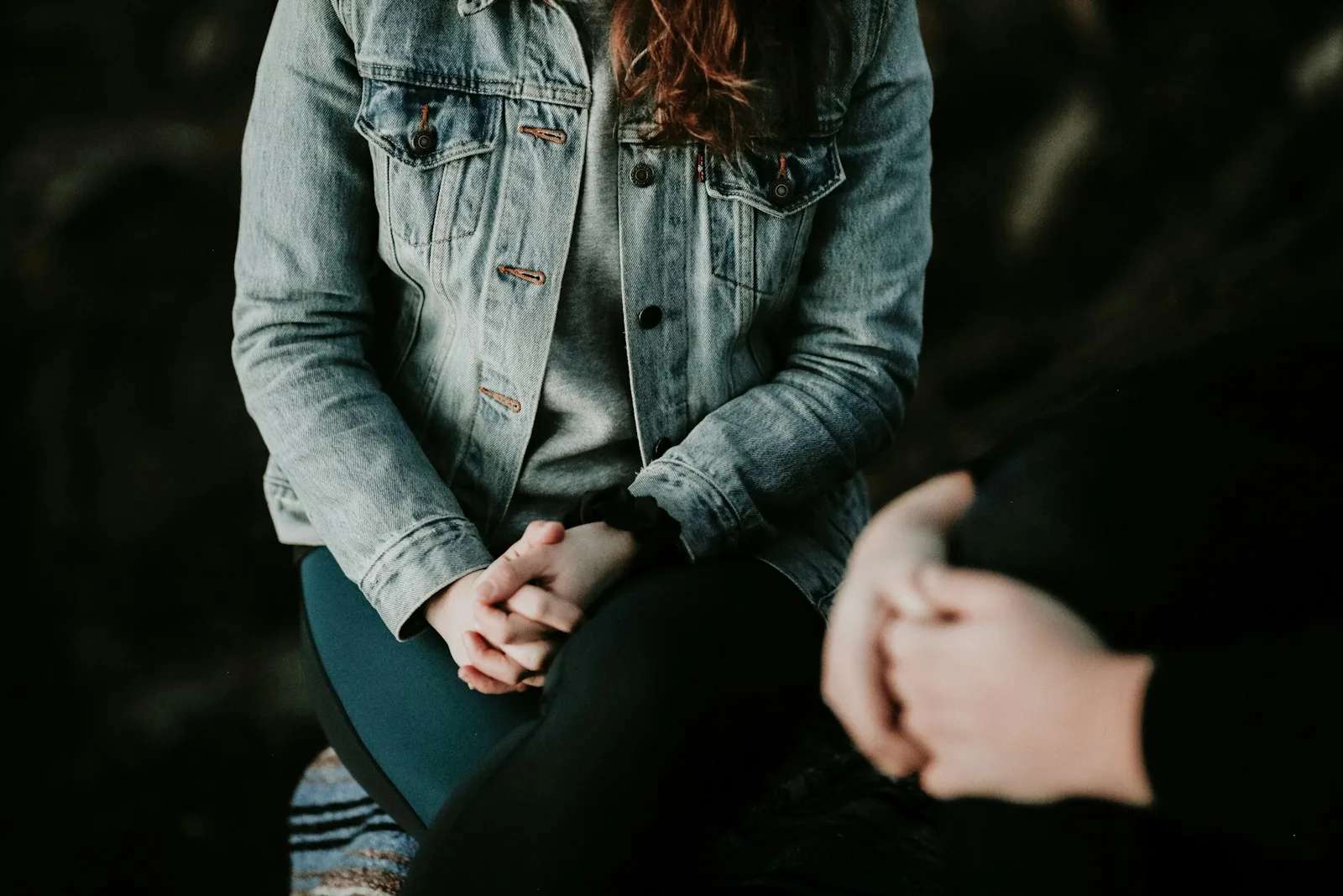 Two people sitting together in conversation